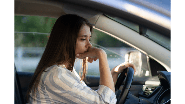 a woman sitting in a car